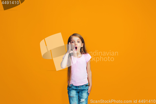 Image of Isolated on orange young casual teen girl shouting at studio