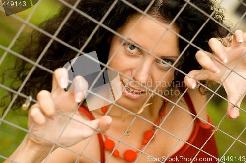 Image of woman behind a lattice 