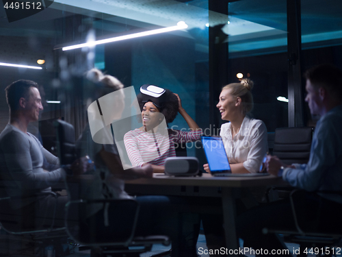 Image of Multiethnic Business team using virtual reality headset