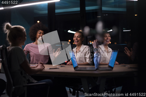 Image of Multiethnic startup business team in night office