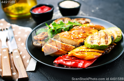 Image of chicken meat with grilled vegetables