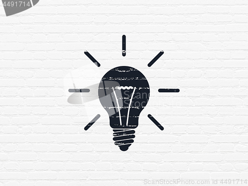 Image of Finance concept: Light Bulb on wall background