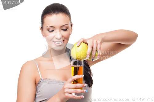 Image of Beautiful girl with apple and glass of juice