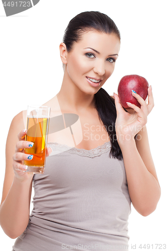 Image of Beautiful girl with apple and glass of juice