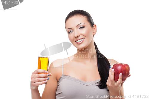 Image of Beautiful girl with apple and glass of juice