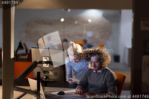 Image of young designers in the night office