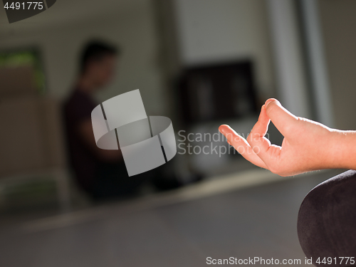 Image of young woman doing morning yoga exercises