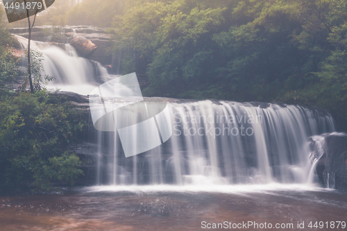 Image of Beautiful full flowing waterfalls after rain