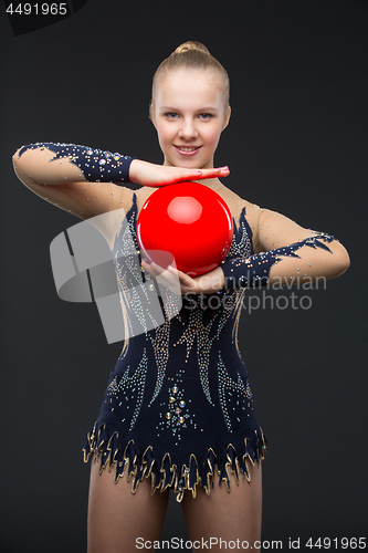 Image of Gymnastist girl with red ball