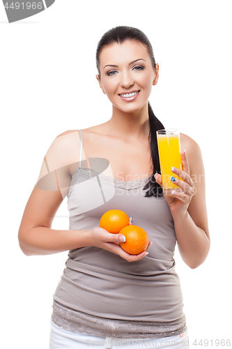 Image of Beautiful girl with oranges and orange juice