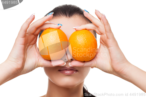 Image of Beautiful girl with oranges