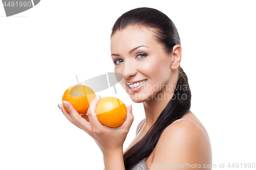 Image of Beautiful girl with oranges