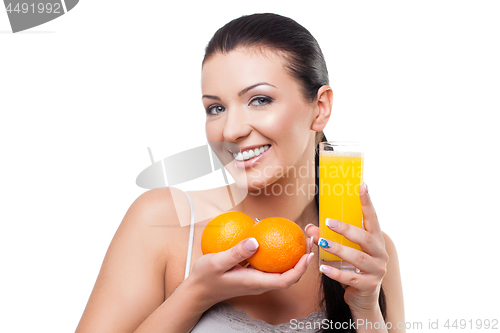 Image of Beautiful girl with oranges and orange juice