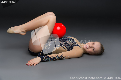 Image of Gymnastist girl with red ball