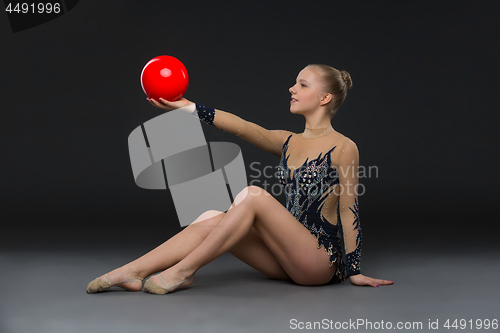 Image of Gymnastist girl with red ball