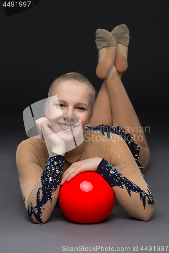 Image of Gymnastist girl with red ball