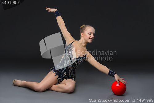 Image of Gymnastist girl with red ball