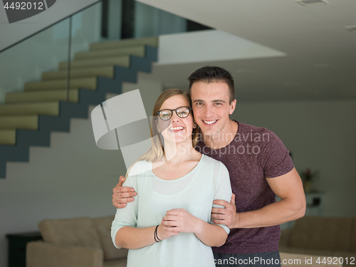 Image of couple hugging in their new home