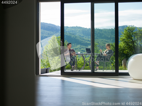 Image of couple enjoying morning coffee and breakfast