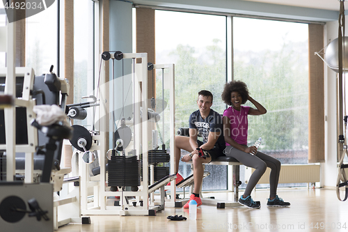 Image of couple in a gym have break