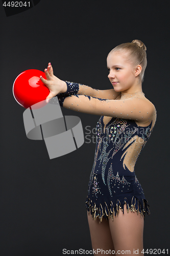 Image of Gymnastist girl with red ball