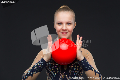 Image of Gymnastist girl with red ball