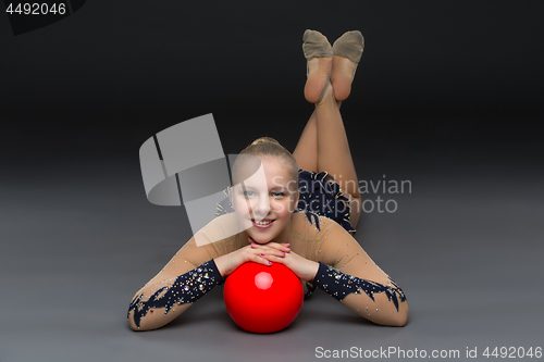 Image of Gymnastist girl with red ball