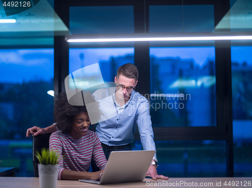 Image of Multiethnic startup business team in night office