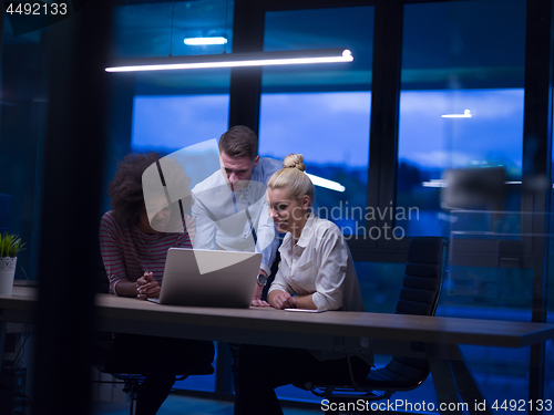 Image of Multiethnic startup business team in night office