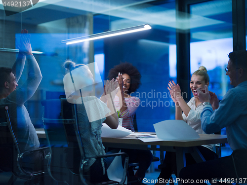 Image of Multiethnic startup business team in night office