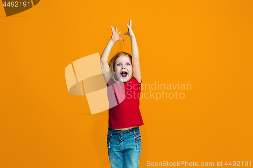 Image of Happy success teen girl celebrating being a winner. Dynamic energetic image of female model