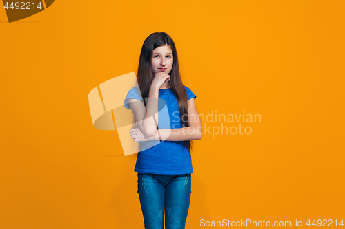 Image of Young serious thoughtful teen girl. Doubt concept.