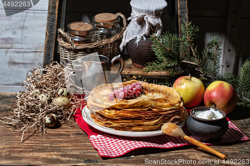 Image of Pancakes On An Old Wooden desk
