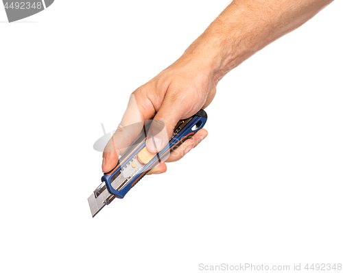 Image of Hand holding stationery knife