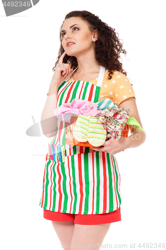 Image of Young housewife on white