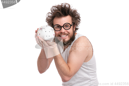 Image of Crazy bearded man with piggy bank