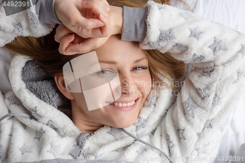 Image of Woman lying in bed