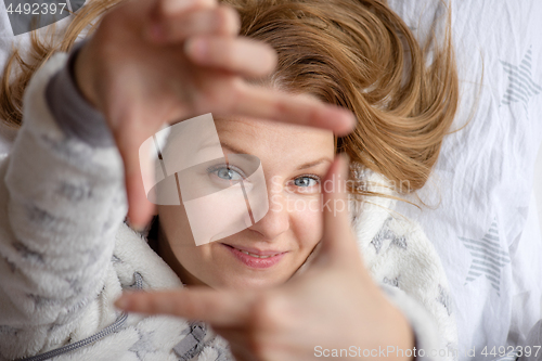 Image of Woman lying in bed