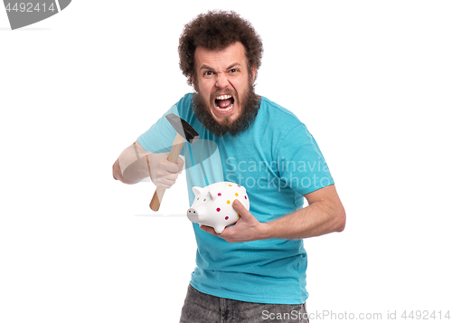 Image of Crazy bearded man with piggy bank