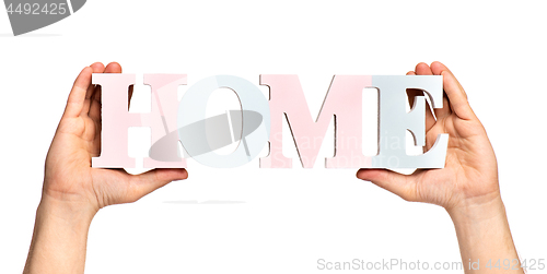 Image of Hands holding Home word