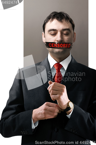 Image of man with black censored tape