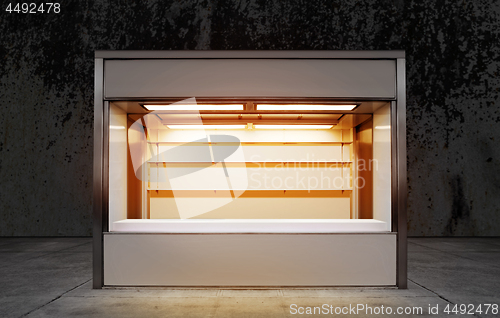 Image of small store on street at night time