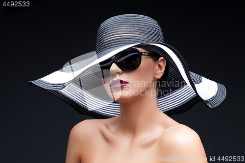 Image of Beautiful girl in large hat