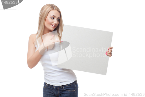 Image of Beautiful blond girl holding blank poster