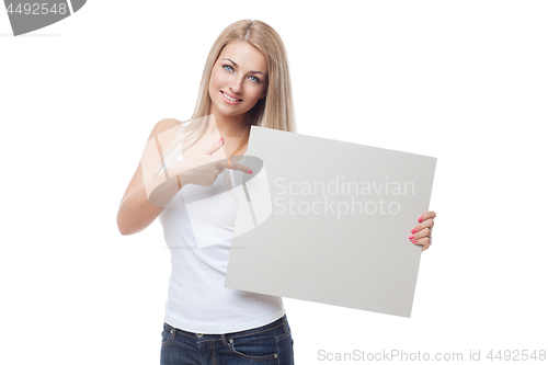 Image of Beautiful blond girl holding blank poster