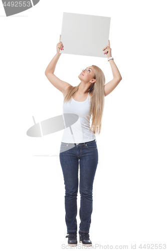 Image of Beautiful blond girl holding blank poster