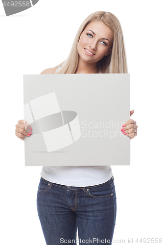 Image of Beautiful blond girl holding blank poster