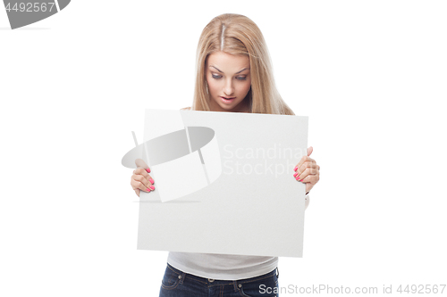 Image of Beautiful blond girl holding blank poster