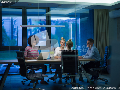 Image of Multiethnic startup business team in night office