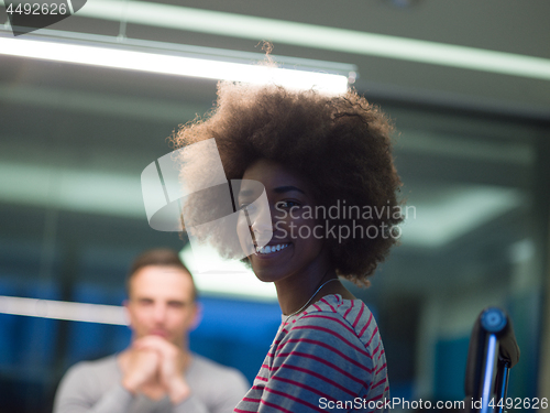 Image of Multiethnic startup business team in night office